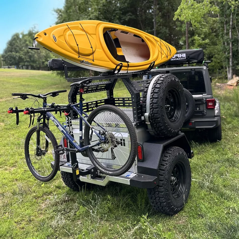 The Ushi Chuck can be equipped with hitch and roof carriers to become an all-out multi-sport trailer (but you might have to move the rooftop tent to the tow vehicle, as done here)