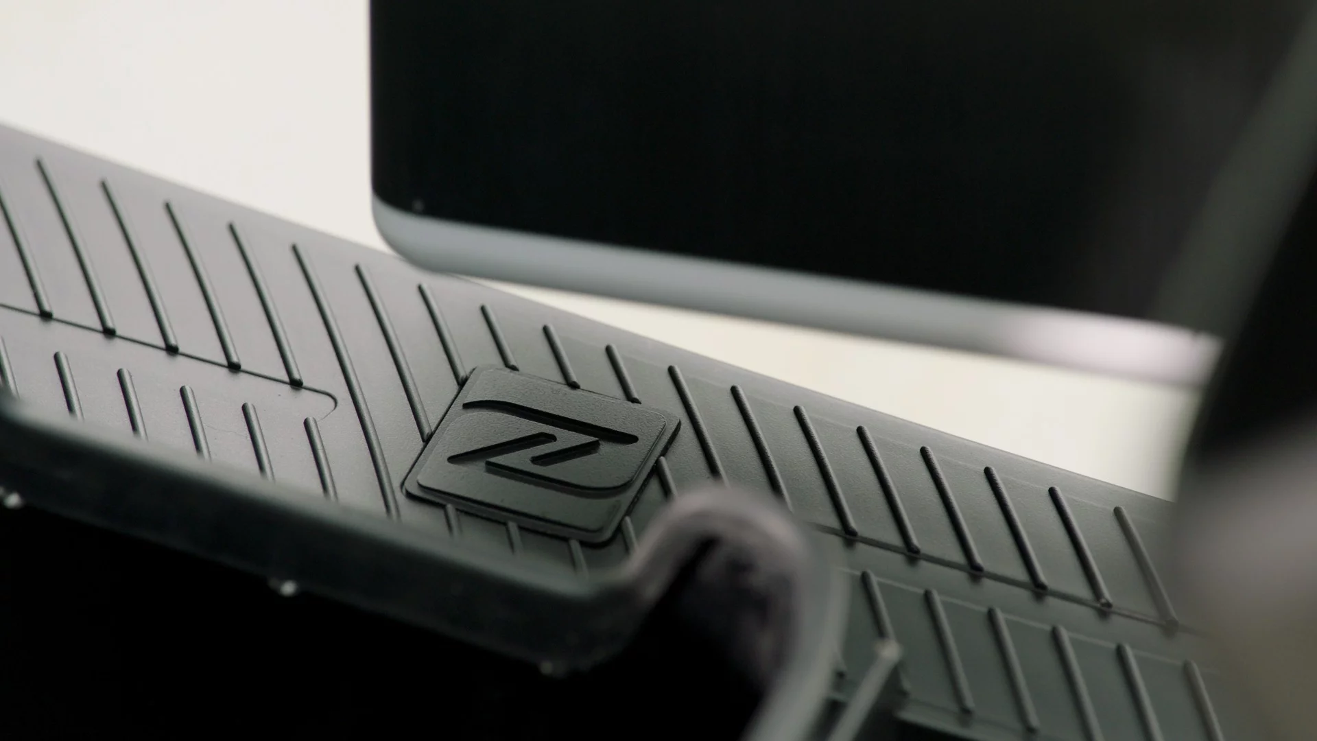 Two smart buttons on each side of the floorboard of the 2018 KYMCO Ionex open up the battery bay