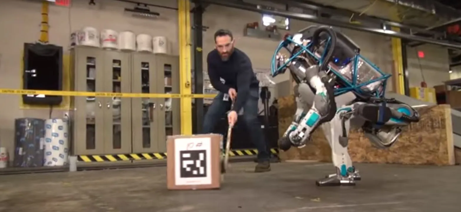 The latest Atlas robot chasing a box being kept from it