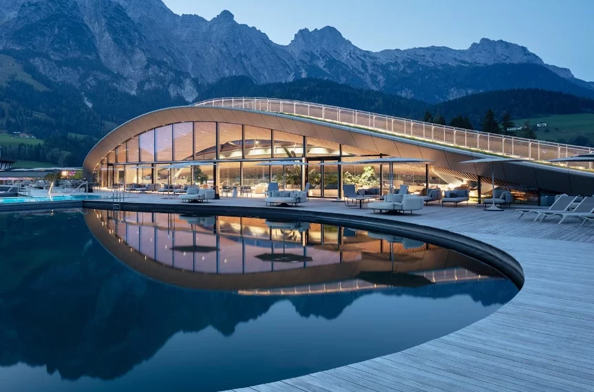 The design of the "ATMOSPHERE" project showcases a striking curved split-roof structure spanning over 100 meters (328 ft)