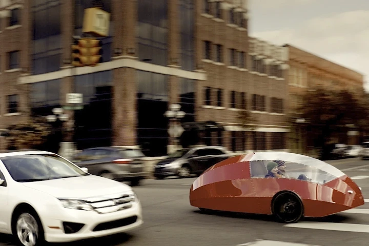The futuristic looking Zeppelin three-wheeler features an aluminum and polycarbonate exterior and a 750 watt electric rear motor to supplement pedal-power