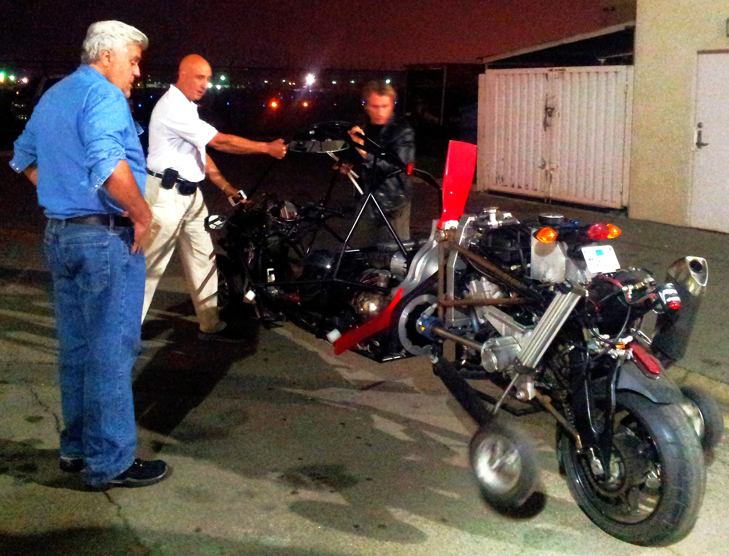 Jay Leno inspects the G2 flying motorcycle