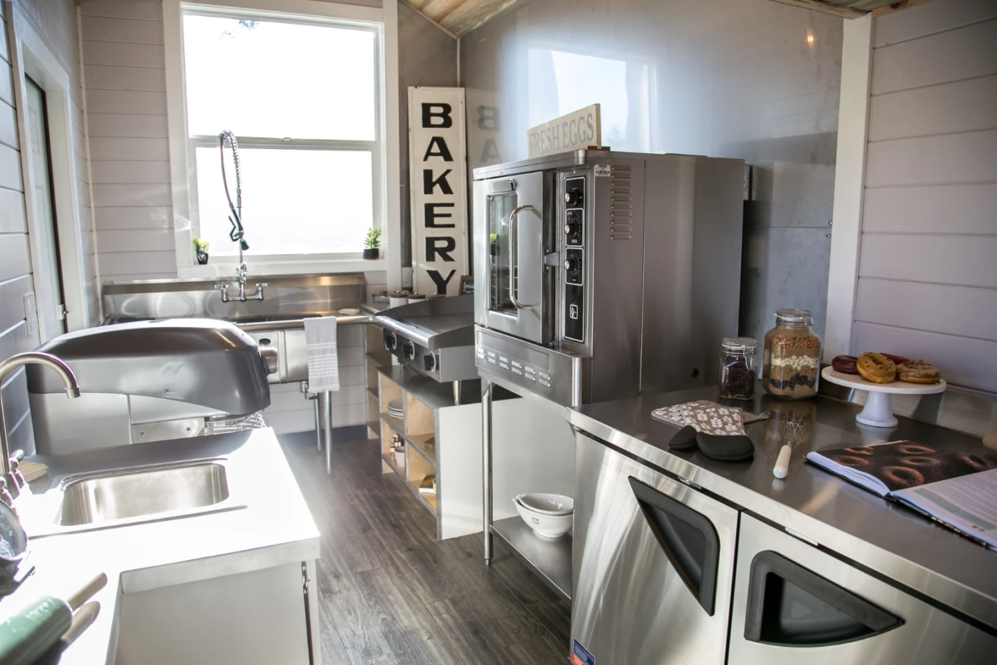 The Kentucky Donut Shop's kitchen includes a sink, microwave, fryer, fridge/freezer, and more