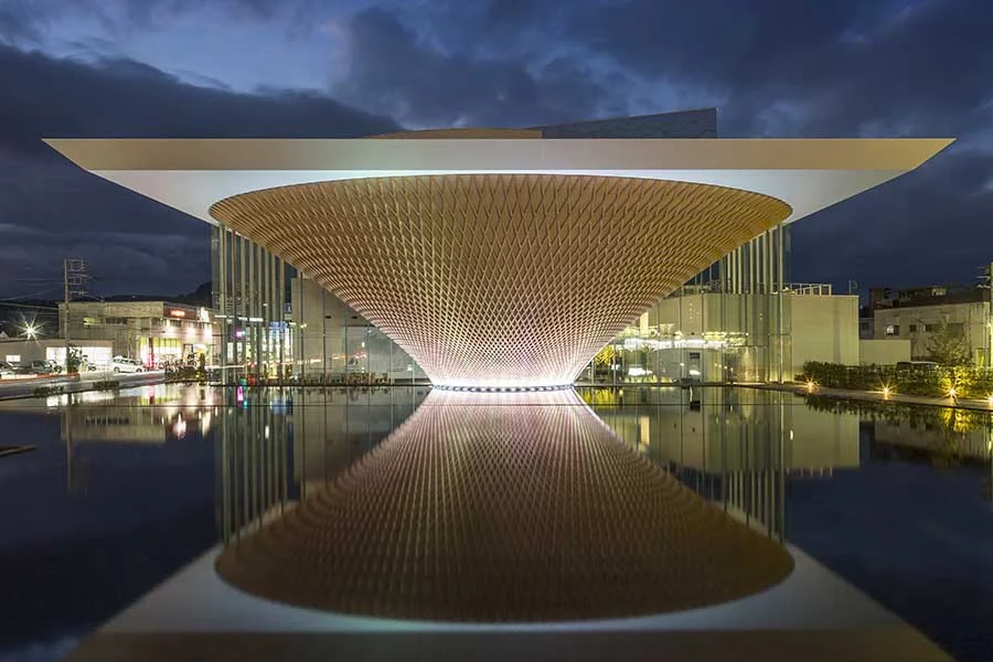 The upside-down pyramid that makes up the Mount Fuji Heritage Center is covered in an intricate timber lattice
