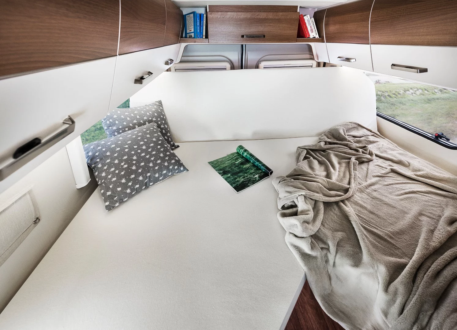 The 600 L and 630 L models have a versatile rear bed; fold the head and you have a couch looking into the van