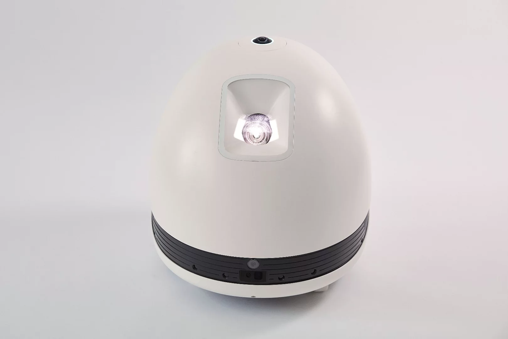 The roughly egg-shaped Keecker has an LED projection unit to the front that throws out a 78-inch, 720p image
