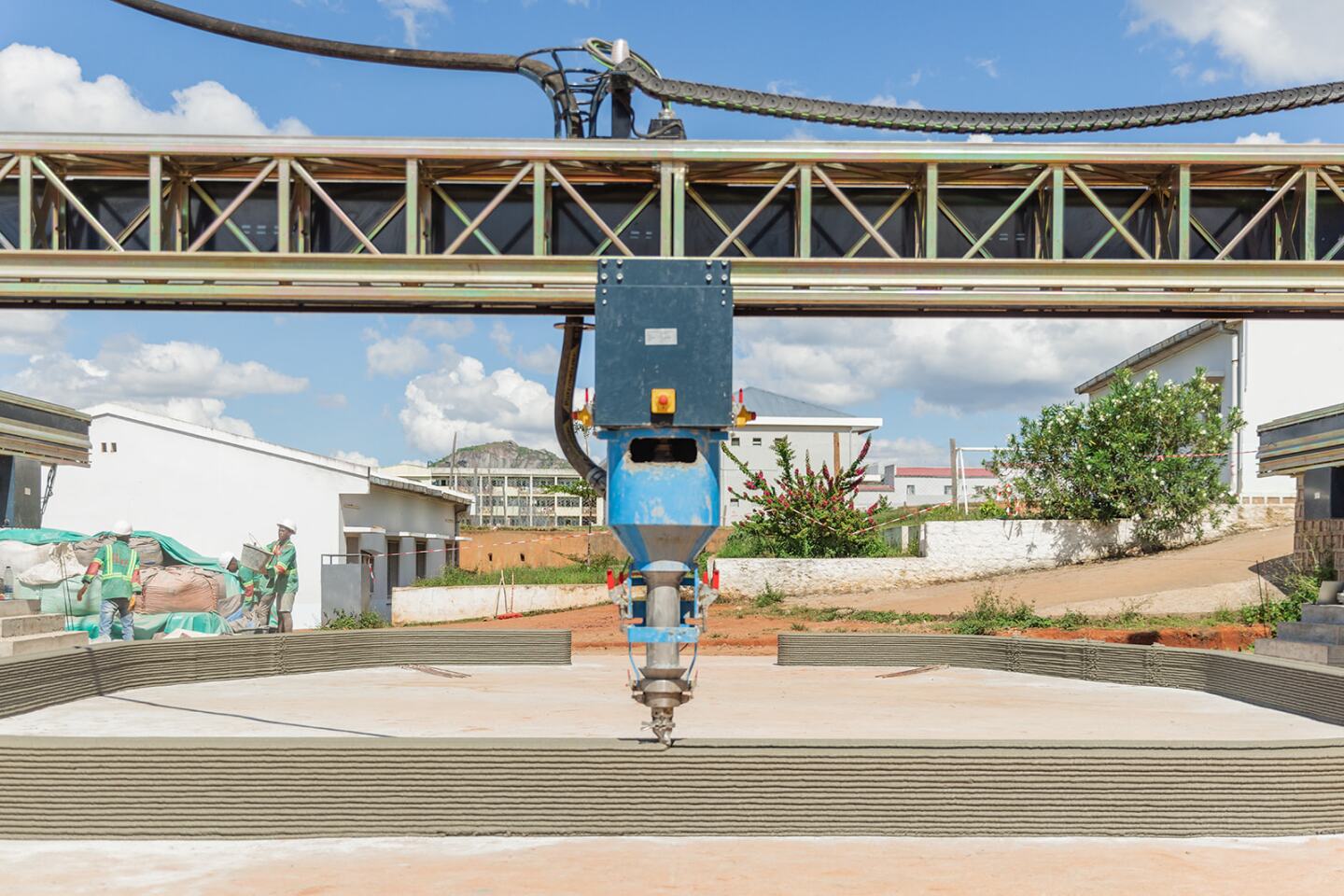 Bougainvillea's construction process involved a 3D printer extruding a cement-like mixture out of a nozzle in a pattern to build up the basic walls