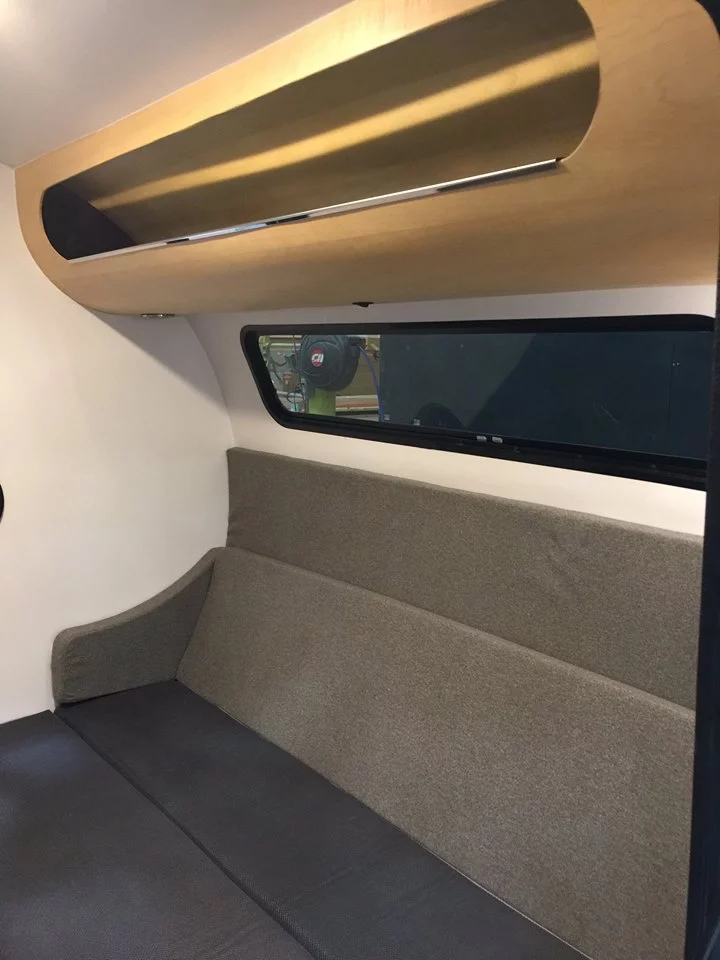 The Bean mattress can slid up to double as a sofa for relaxing and working