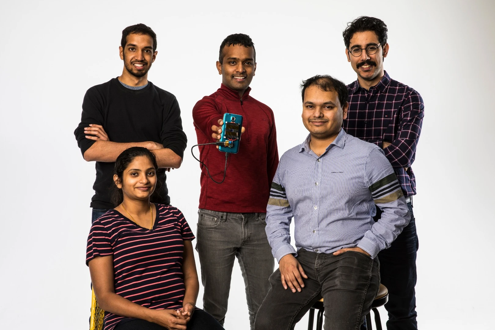 The research team on the laser charger project: from left, Vikram Iyer, Rajalakshmi Nandakumar, Shyam Gollakota, Arka Majumdar, Elyas Bayati