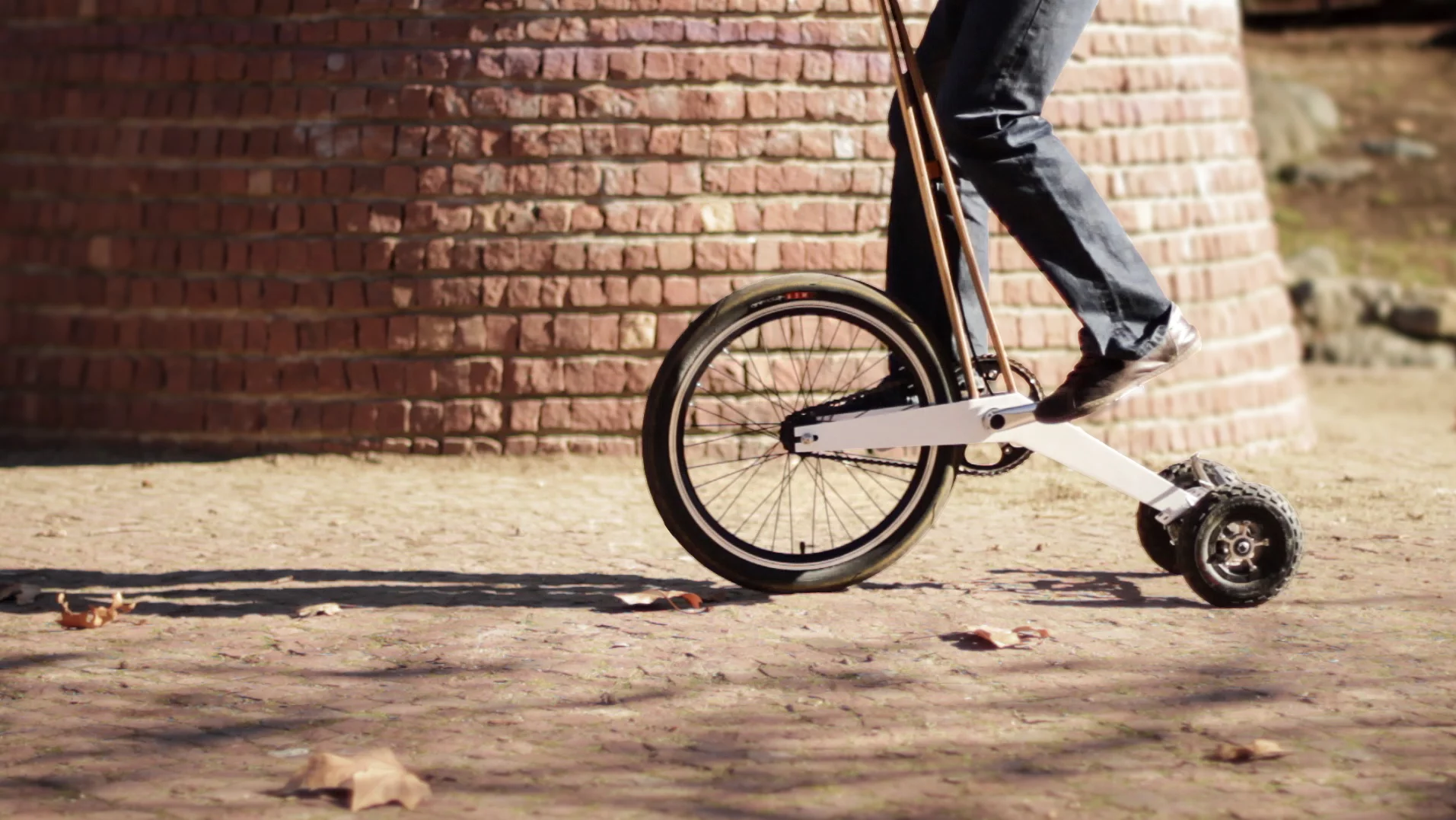 The Halfbike's standup design and riding pole mean riders receive no rest periods during trips