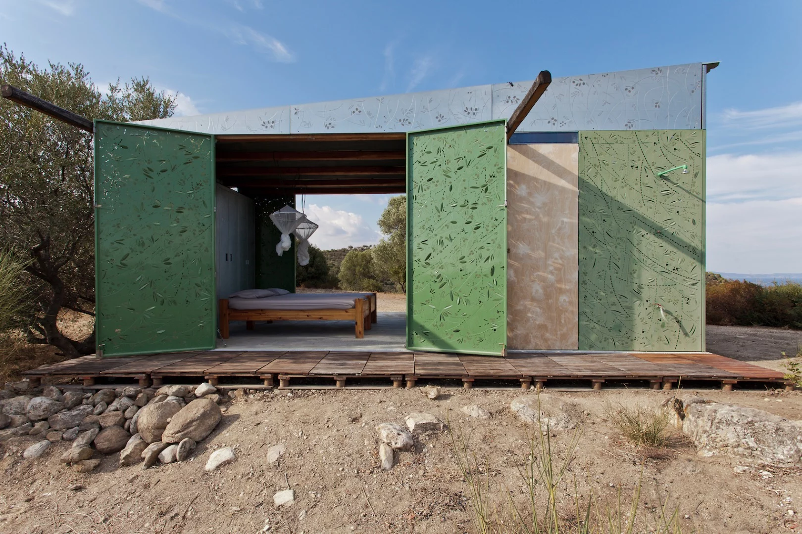 The Olive Tree House's walls open up