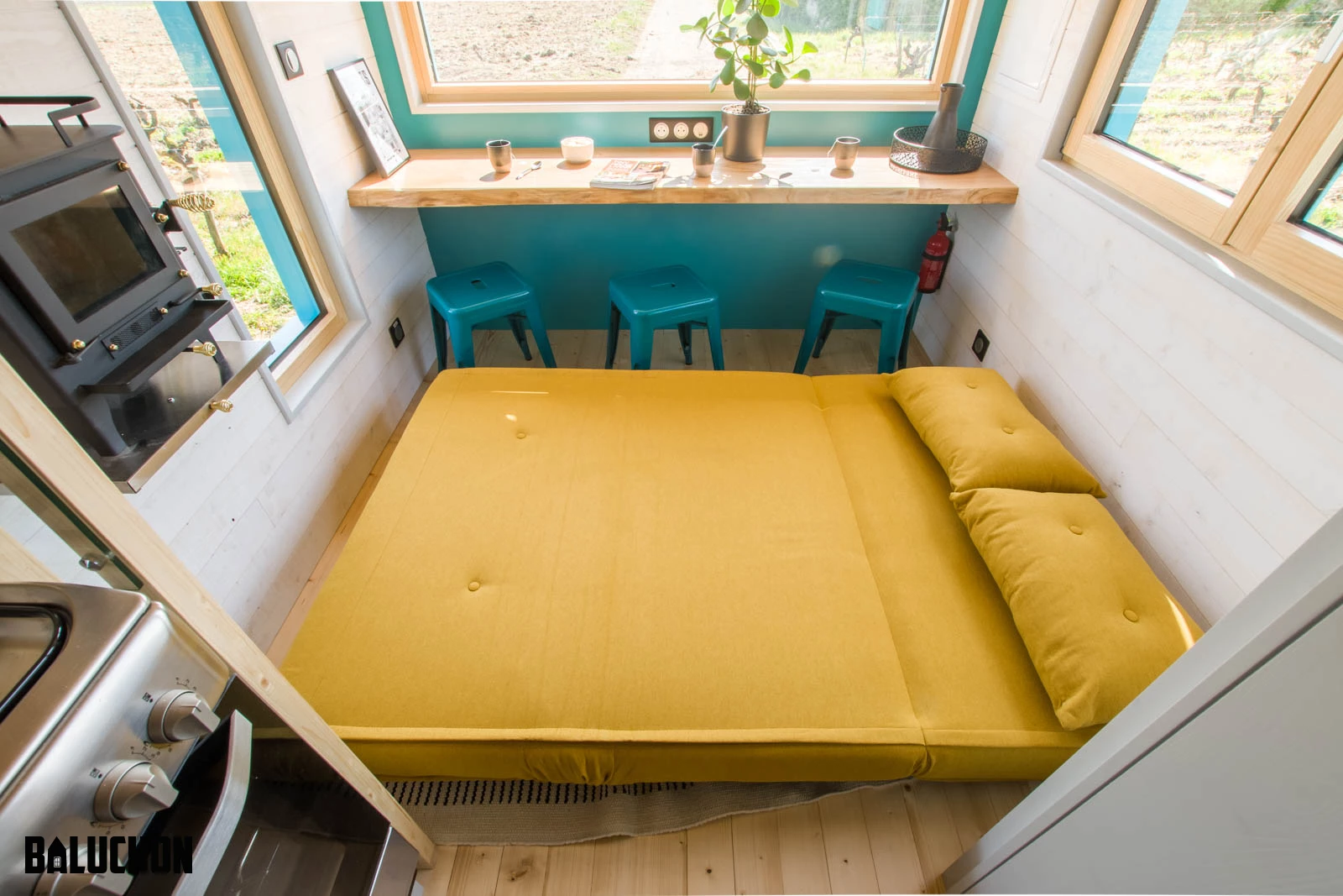 Tiny House Sïana's living room includes a sofa bed that can sleep two guests