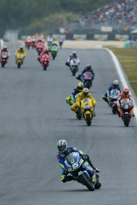 The first lap is completed and Sete has already checked out from the bunch. That's Carlos Checa and Maxs Biaggi leading the charge from Valentino Rossi and Marco Melandri, Colin Edwards, John Hopkins, Carlos Checa, Troy Bayliss and Nicky Hayden