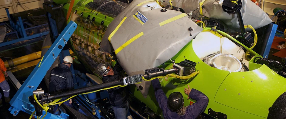 Technicians prepare the DEEPSEA CHALLENGER for a dive (Photo: National Geographic)