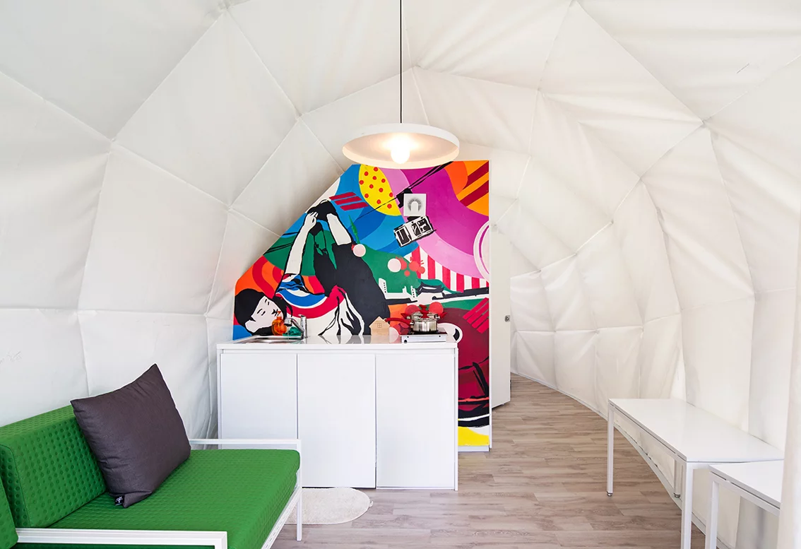 The unit features a large living zone with modern furniture also designed by Archiworkshop (Photo: June Young Lim)
