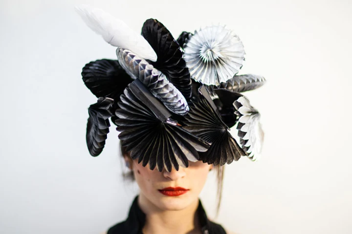 Fans on the hat instantly unfold to shield the wearer from loud noises, bright lights or unwanted proximity when triggered (Photo: Sangli Design)