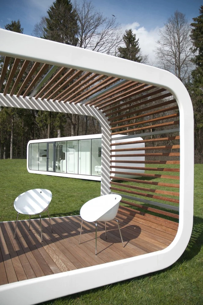 The unit features a galvanized and powder coated steel frame, with wooden batten perimeter and flooring