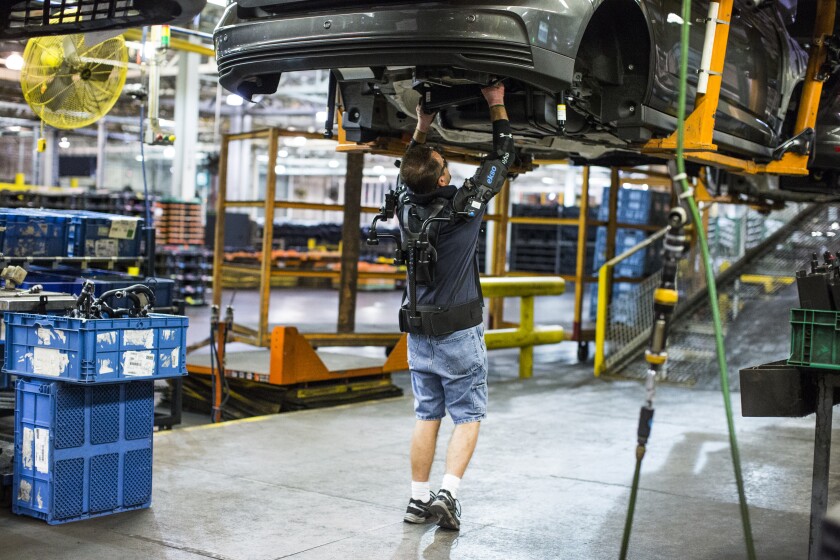The EksoVest uses springs to provide adjustable lift assistance of 5 to 15 lb (2.2 to 6.8 kg) per arm
