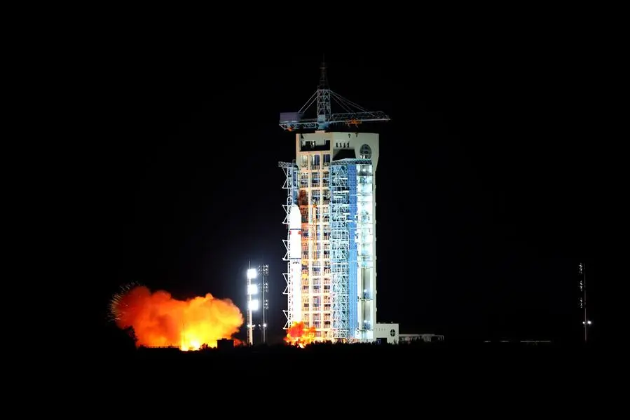 The QUESS satellite being launched on a Long March-2D rocket