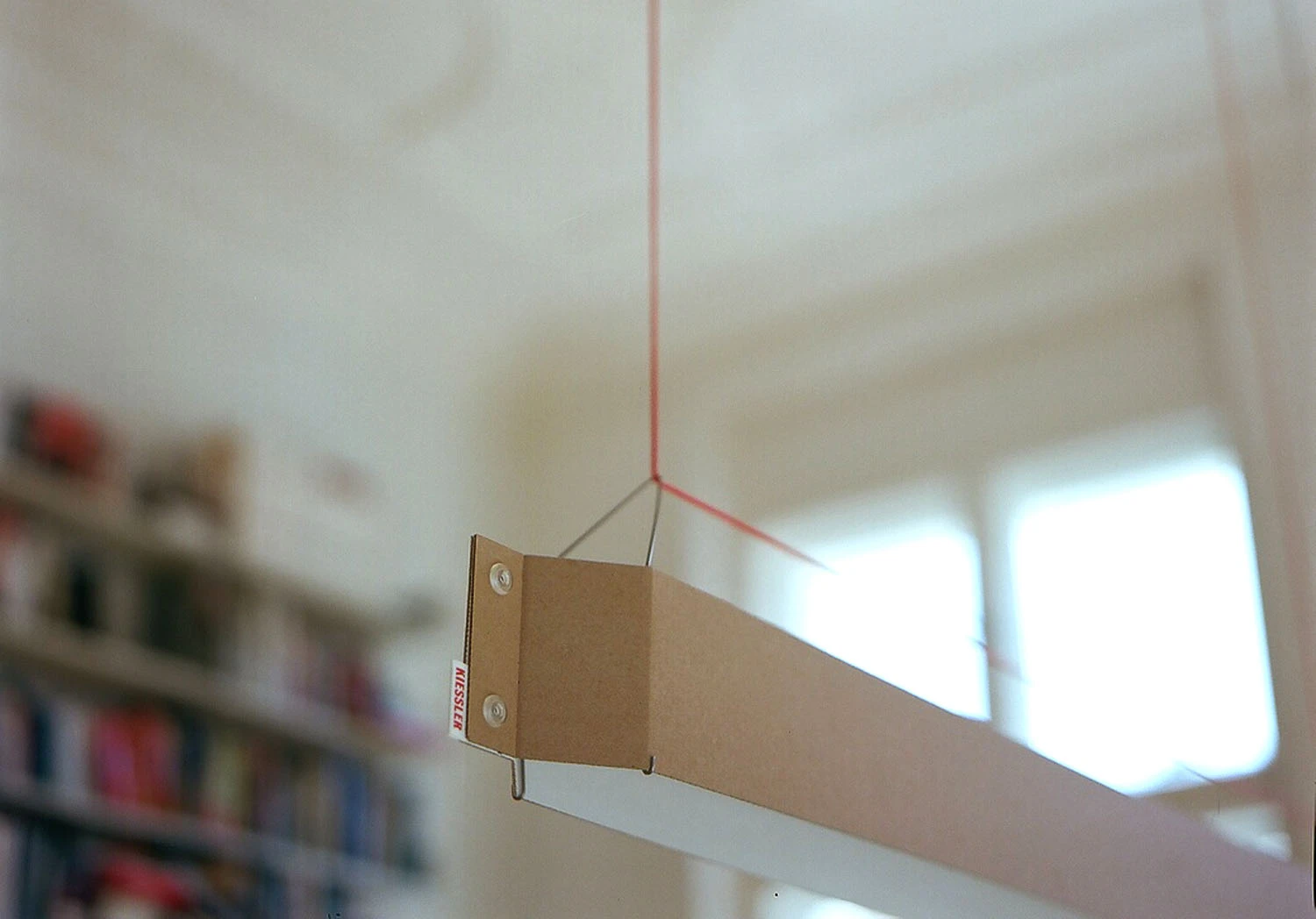 German designer Johannes Kiessler has created a sleek pendant lamp which is predominantly made from cardboard