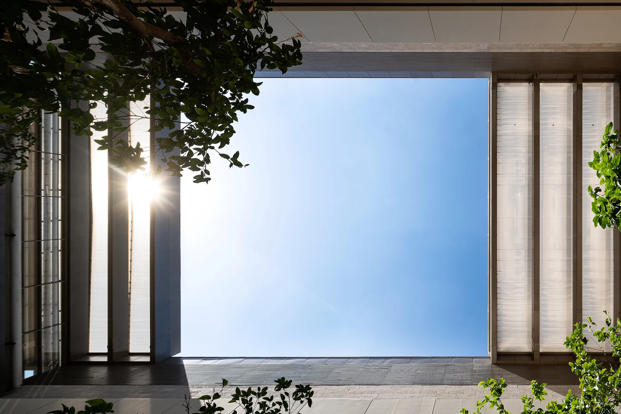 The Edmond and Lily Safra Center for Brain Science's courtyard features an operable roof area that's opened in summer and closed in winter