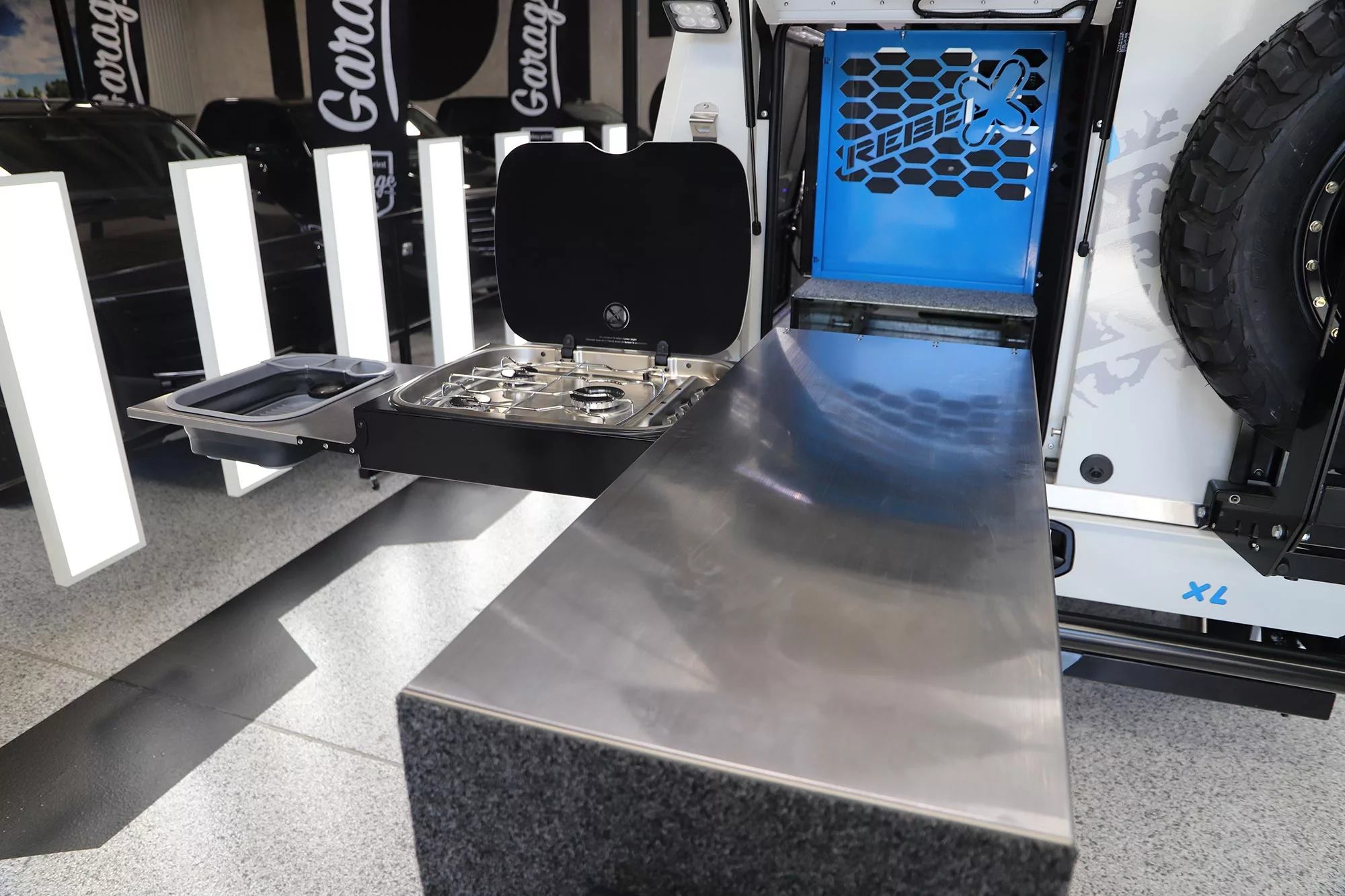 A clever space-saving kitchen, ARB's Slide kitchen packs a three-burner stove and sink basin inside an outer body with long worktop