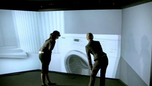 Miele focuses on CAVE (Computer Aided Virtual Environment) in product development. The special projection technology creates a three-dimensional virtual reality which product developers can interact with. Thus, the development process in the Gütersloh pla