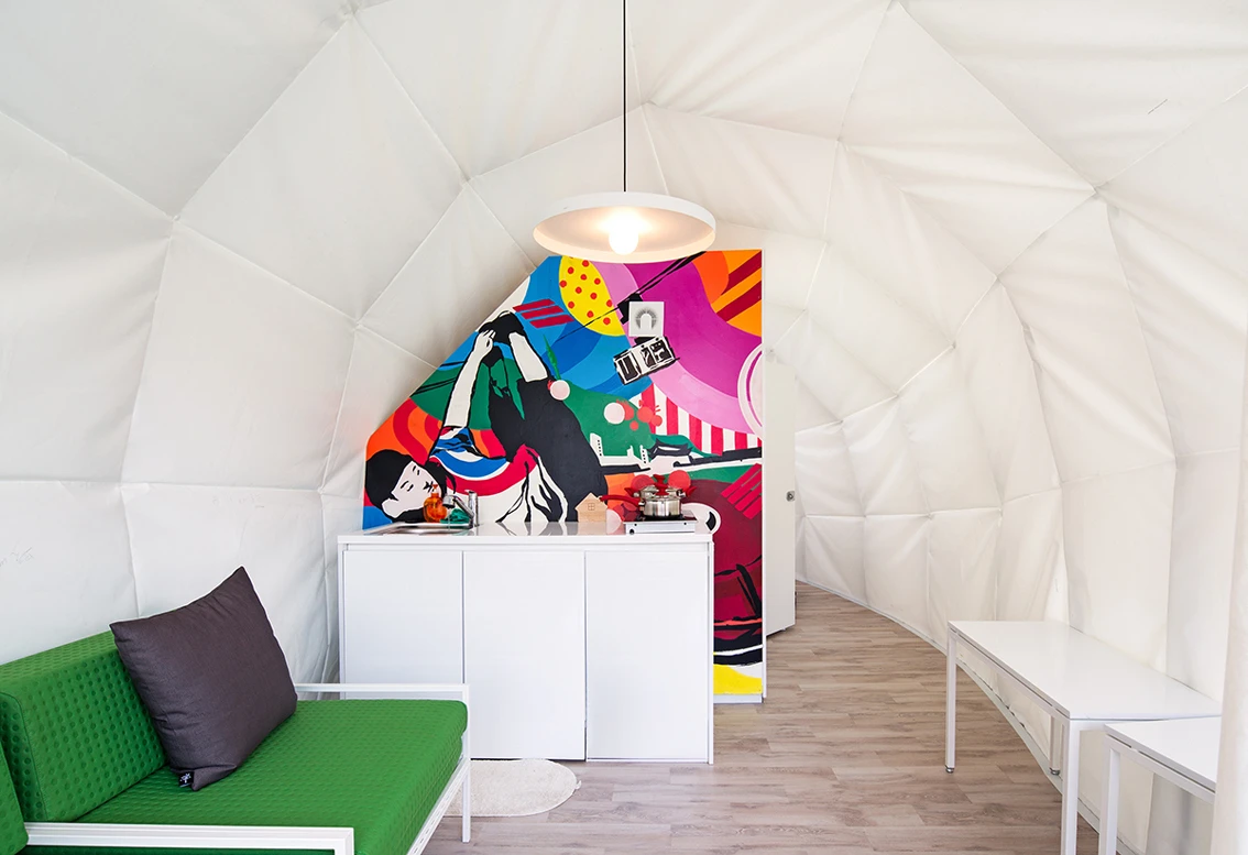 The unit features a large living zone with modern furniture also designed by Archiworkshop (Photo: June Young Lim)