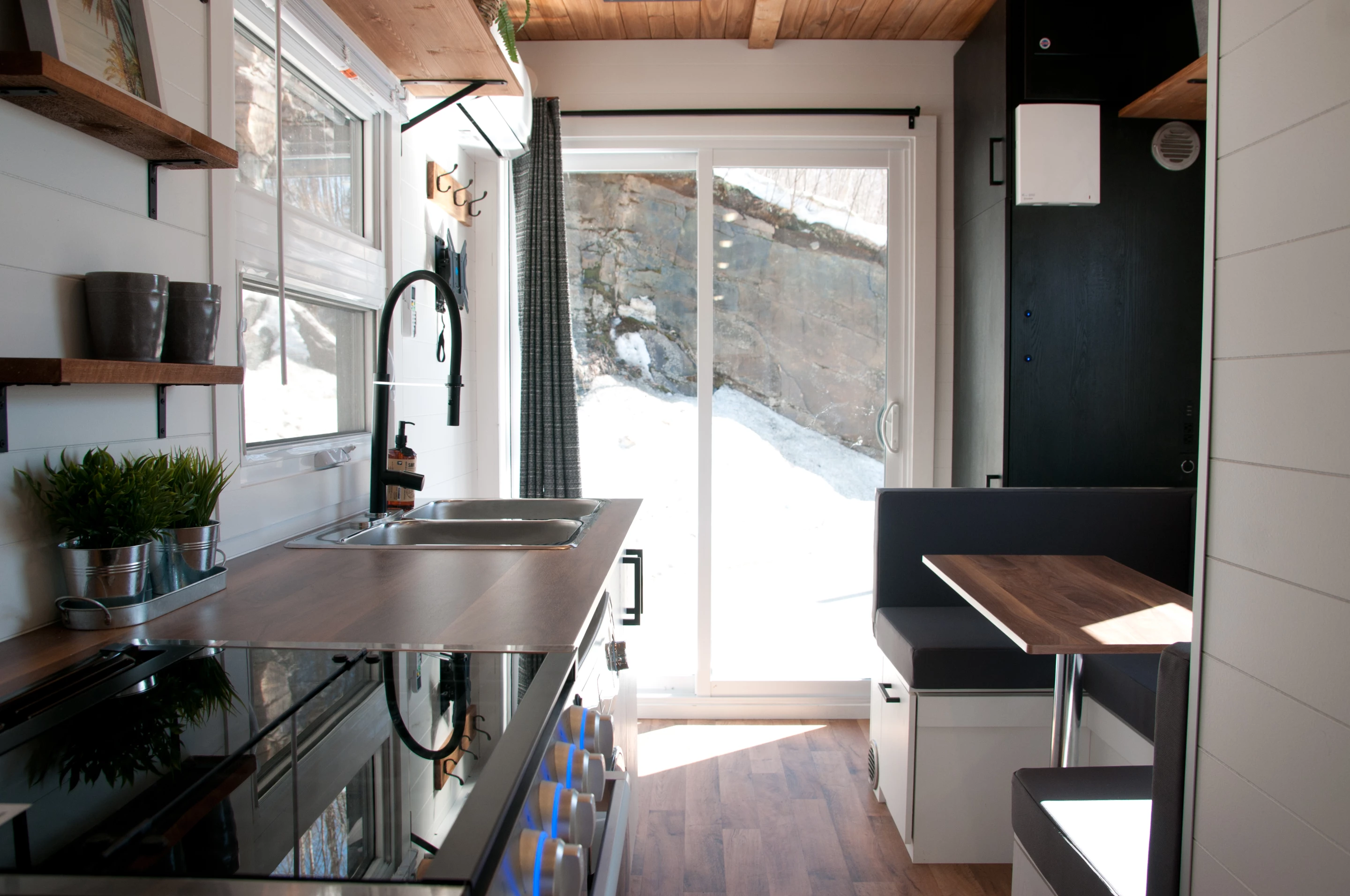 The Nomad is accessed by glass sliding doors