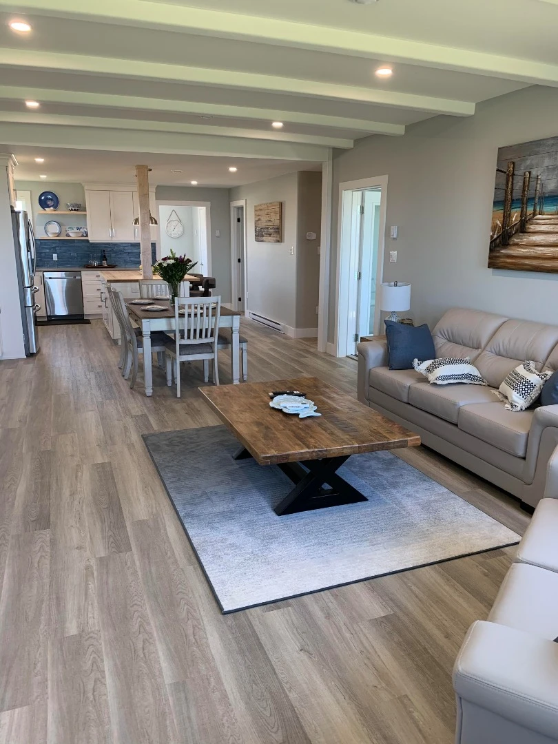 The Beach House is a modern family home boasting a simple facade, seaside themed interior, energy efficiency and hurricane resistance
