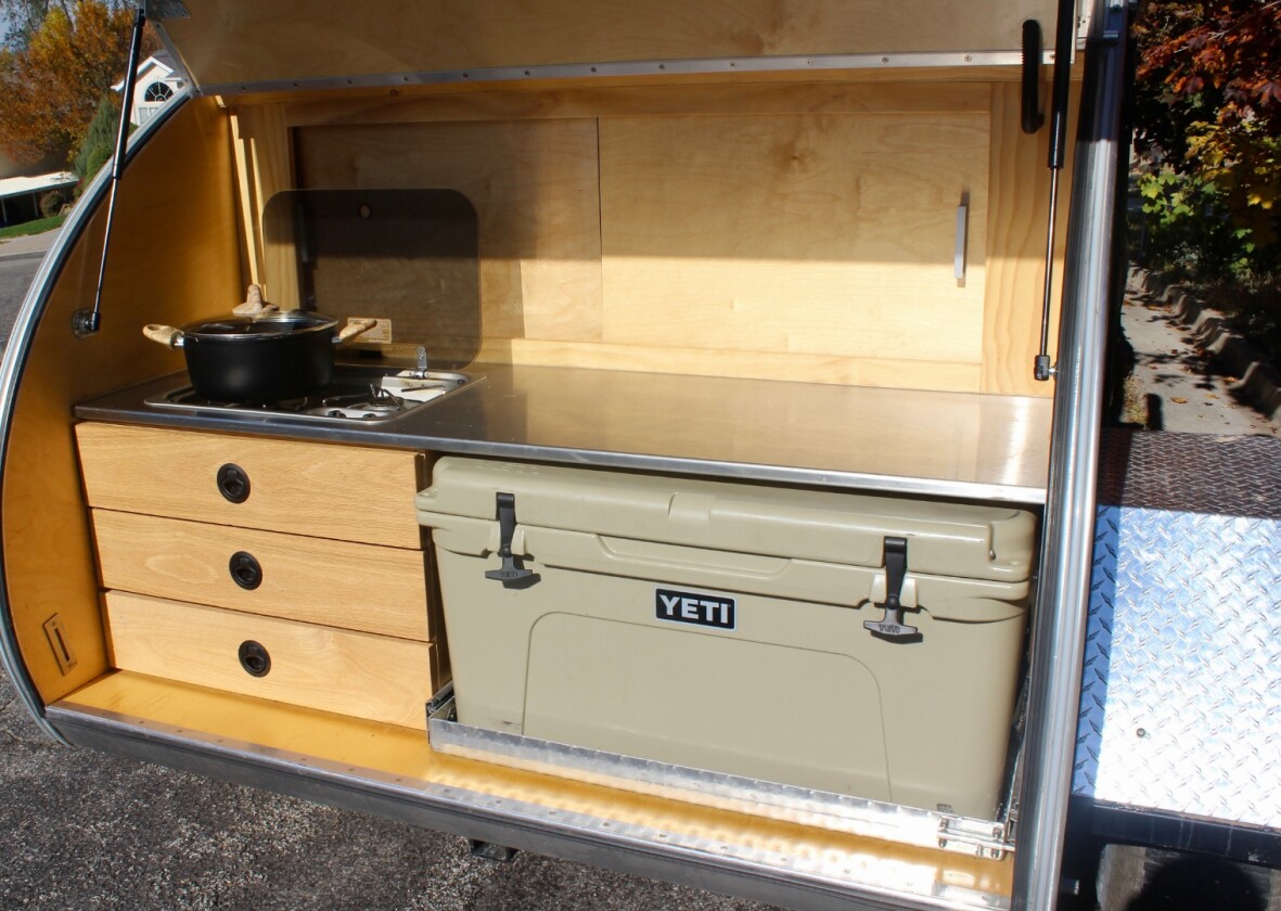 At first, we thought we'd miss a built-in sink and fridge/freezer, but we ended up liking all the countertop space, and the cooler was plenty ample for our long weekend camping trip