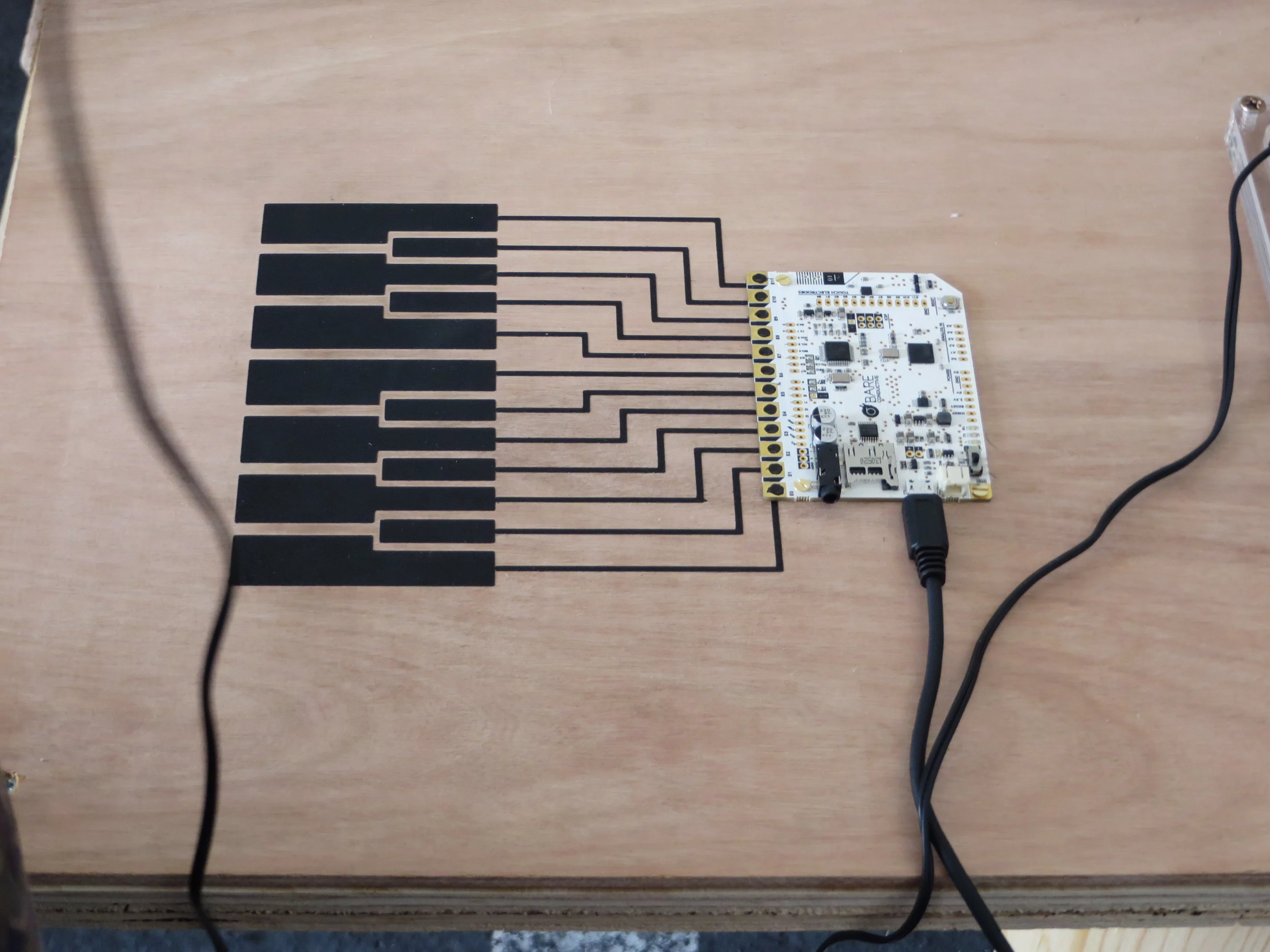 Conductive paint and a custom Arduino board make it easy to brush a piano on to any surface