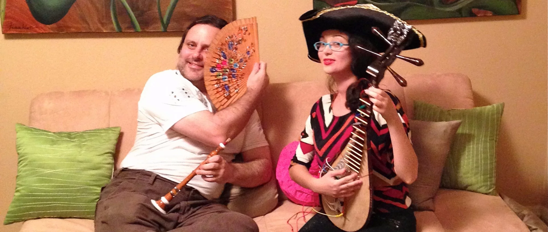 Silver-plated beads are placed on the neck and body of the Ðàn tỳ bà and wired up wot the Makey Makey board at the bridge position on the front of the body