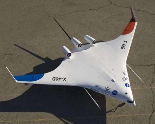 Boeing's Blended-Wing Body (BWB) X-48B prototype, demonstrating its top-mounted jet engines. Photo by Tony Landis, Boeing.