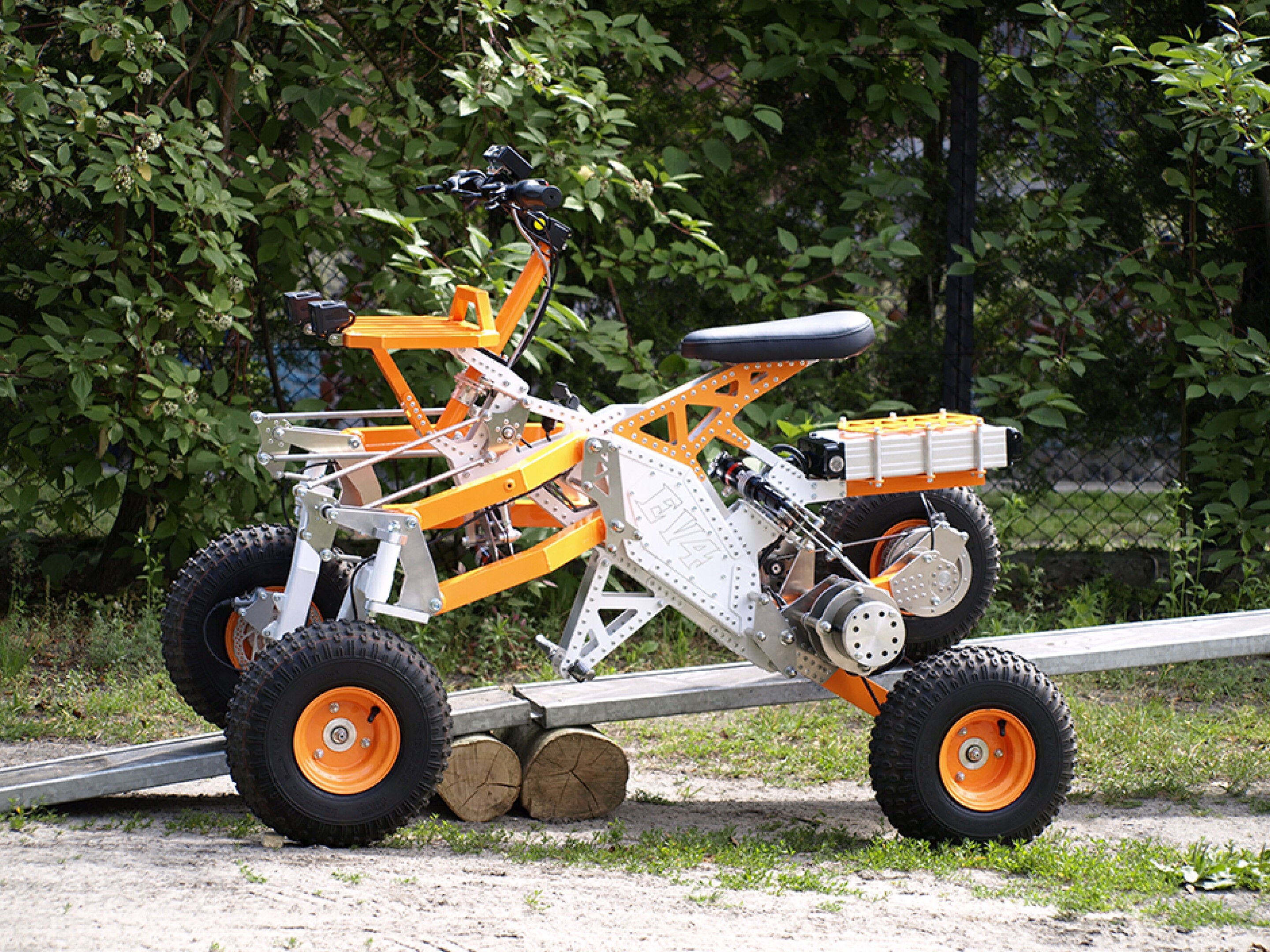 Tilting electric quad gets menacing offroad big brother