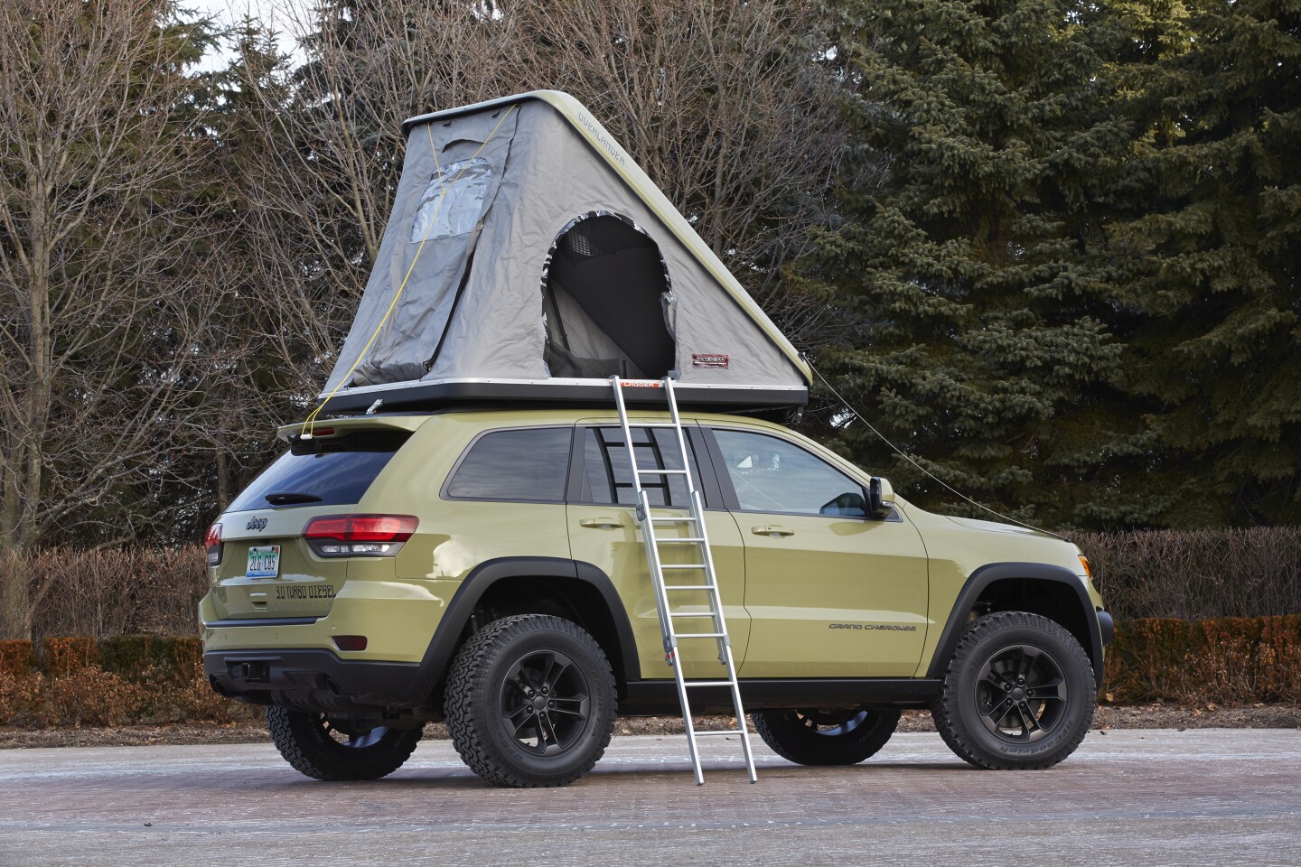 The Grand Cherokee Overlander includes a clamshell roof tent for camping