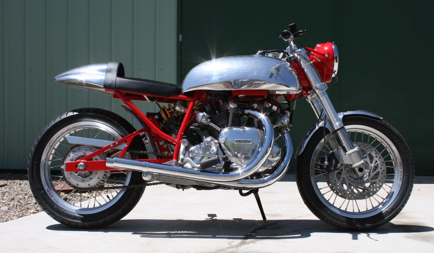 A one-off based loosely around a Vincent motor with a pseudo-Egli frame. This bike was built around an Egli frame built by Terry Prince, an Australian who once worked for Fritz Egli but now manufactures frames and complete Vincent-based bikes in Germany. The overall build was carried out by Sam Manganaro's Vincent Works in Colorado, U.S.A. using a set of magnesium Vincent crankcases cast by some guy in the U.K. who apparently cast five sets. The engine has been upgraded with Terry Prince heads, barrels and other bits, as well as a Prince stroker crank that takes the engine out to 1300cc. The considerable power is carried though a five-speed gearbox from the Horner Brothers in Melbourne, Australia, who also build high quality Vincent-based machines. The mono-shock rear suspension is Öhlins shock absorber, with Ducati Monster forks, KTM hubs and Buchanan's spokes and rims. The tank, seat and front fender are from master craftsman Evan Wilcox in the U.K.