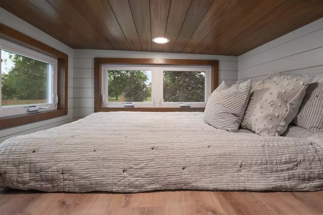 The Pathway's bedroom is a typical loft-style space with a low ceiling