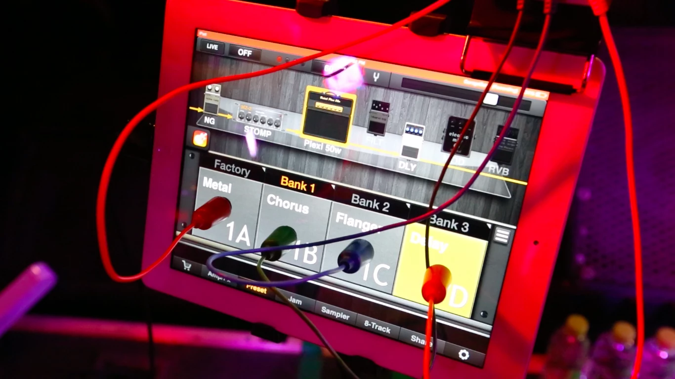 The RemoFinger can switch virtual stomps on or off in GarageBand, without having to take playing hands away from the guitar