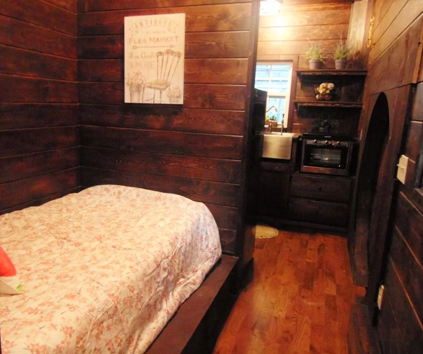 The bedroom, with ample storage space under the bed
