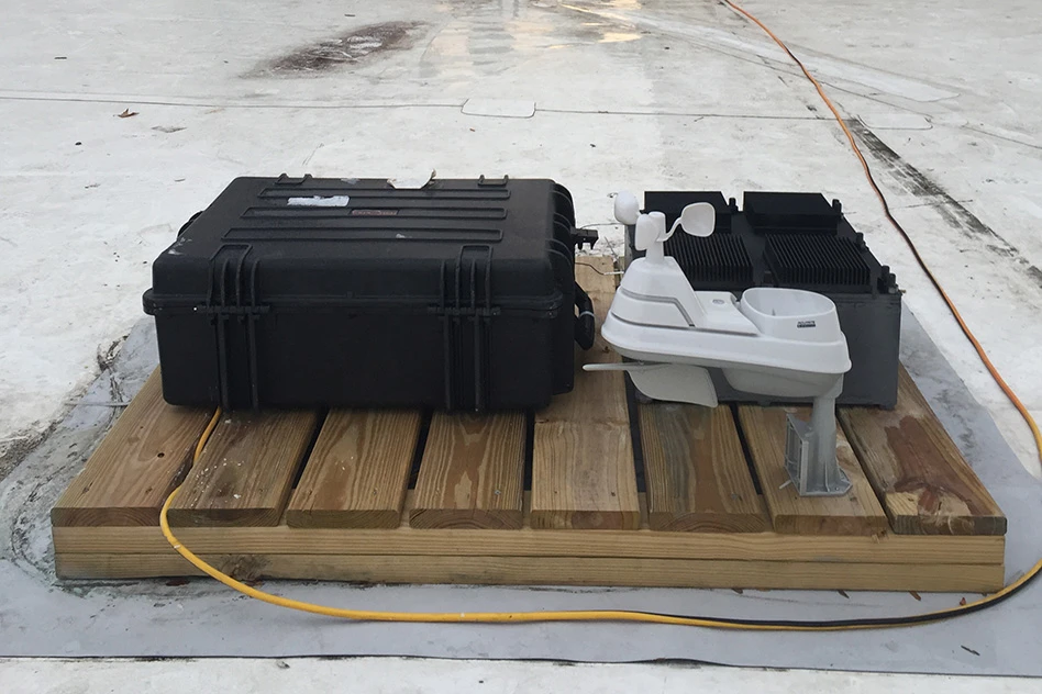 The thermal resonator weather station sits on the roof of an MIT building, generating power through temperature fluctuations