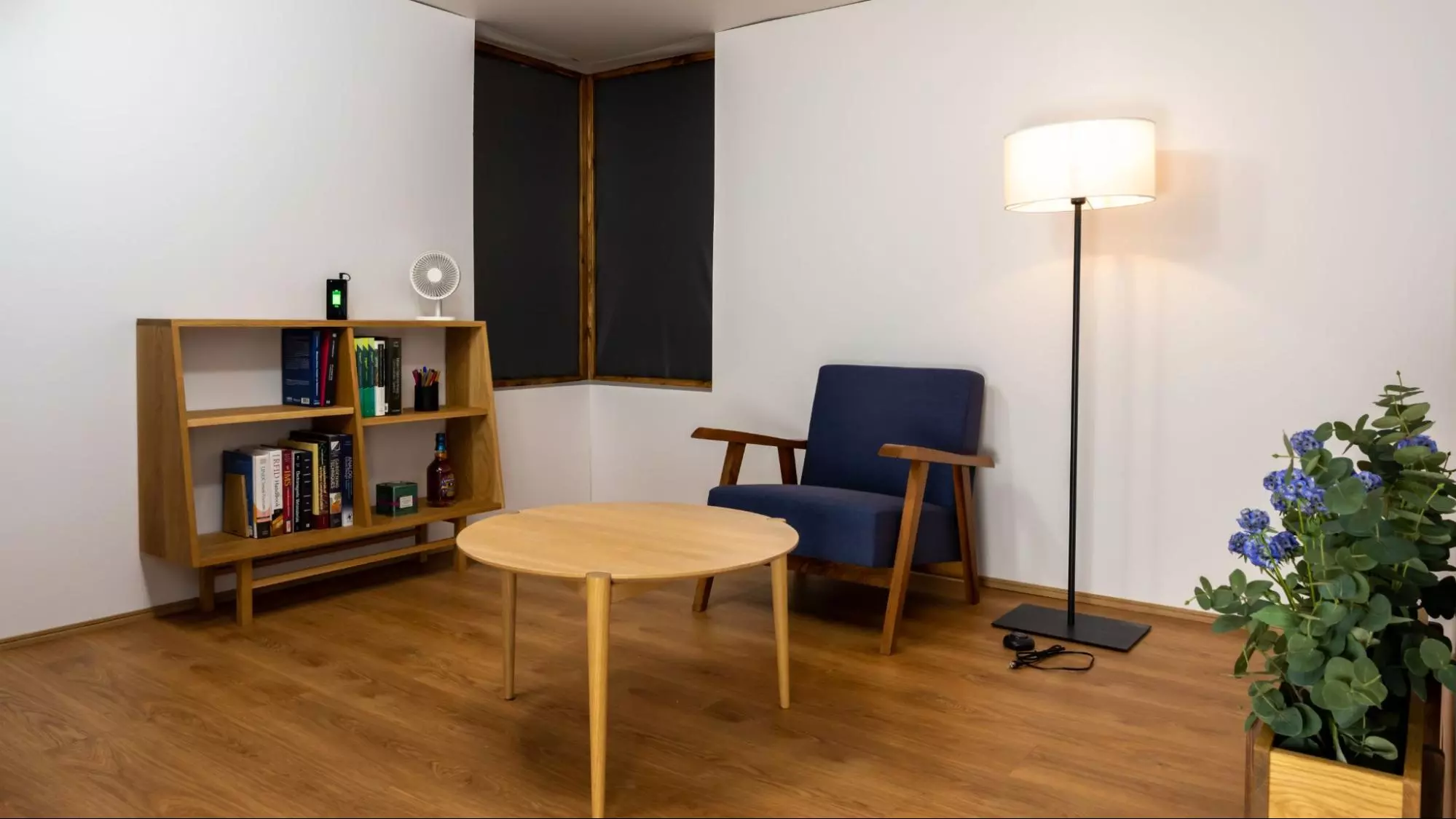 A more real-world version of the wireless charging room, with the system feeding energy wirelessly to the lamp,