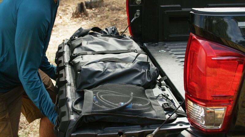 The RinseKit Tailgate Shower measures 52.5 inches wide by 6.5 in thick by 20 in high (1,334 by 165 by 508 mm)