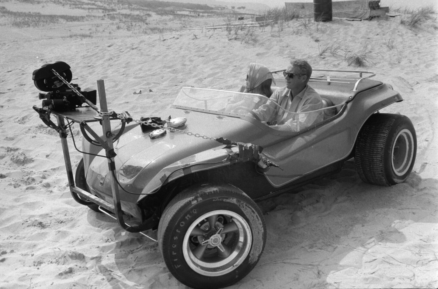 Steve McQueen and Faye Dunaway in the customised Myers Manx dune buggy during filming of the 1968 movie The Thomas Crown Affair