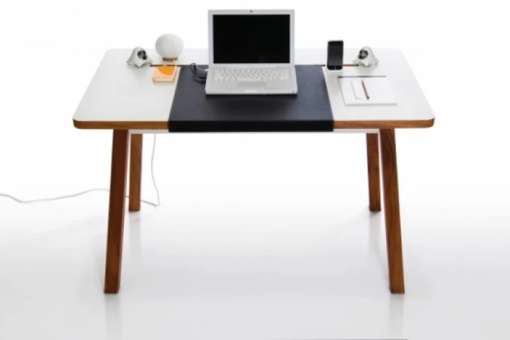 The StudioDesk might look like an ordinary table but it hides away laptop cables and other peripherals