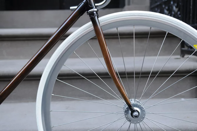 New Zealand's Rob Pollock hand-paints clients' bicycle frames with a faux woodgrain finish