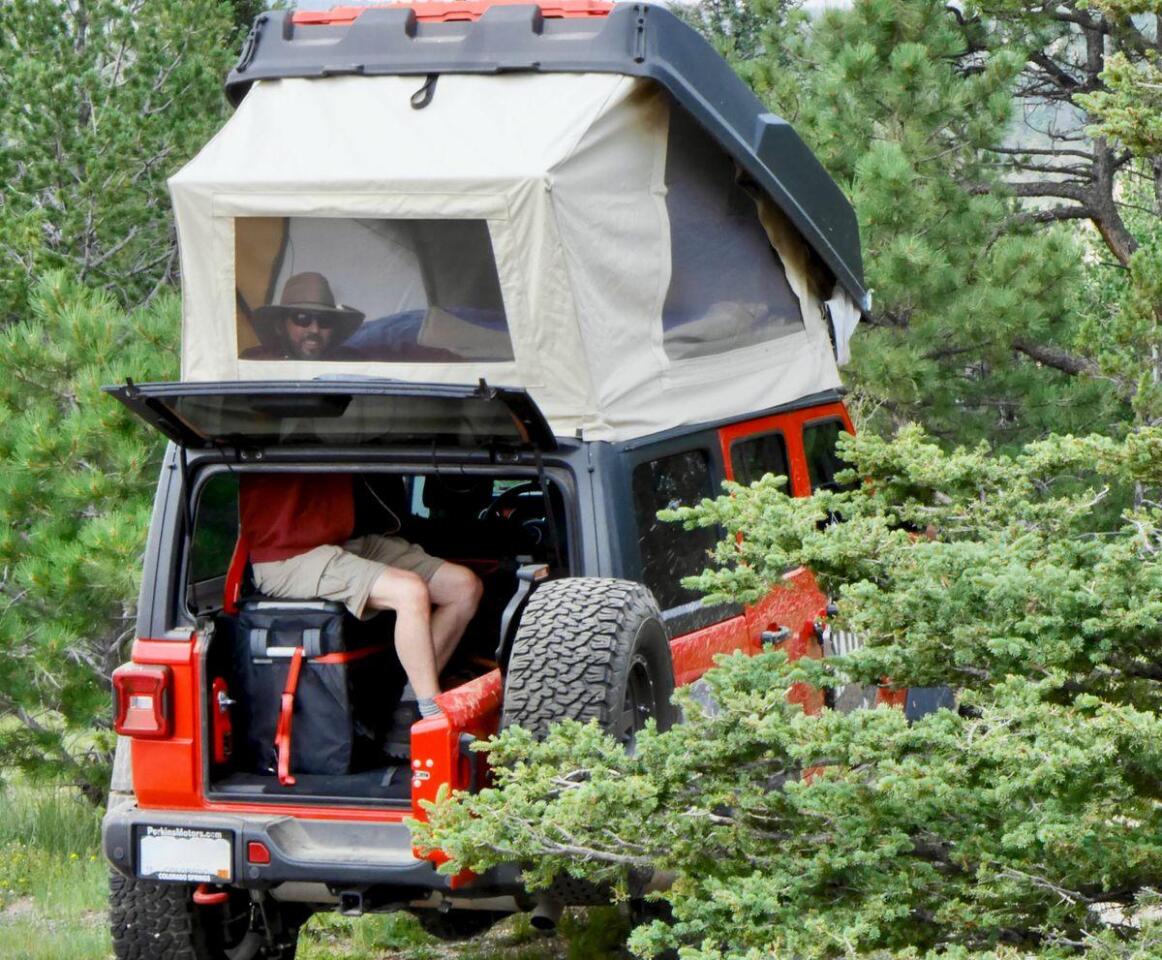 Enjoying the extra headroom in the back of the Wrangler — you can even pull the portable toilet indoors on particularly cold nights