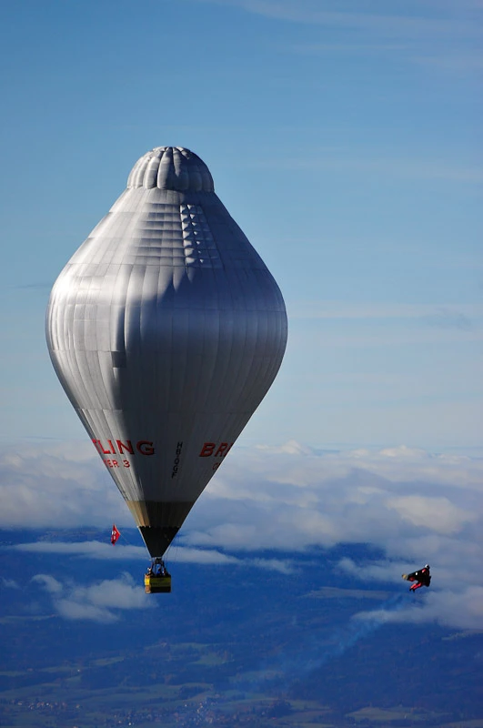 Swiss 'Jetman' Yves Rossy has successfully performed two aerial loops, using his unique strap-on jet-powered wing