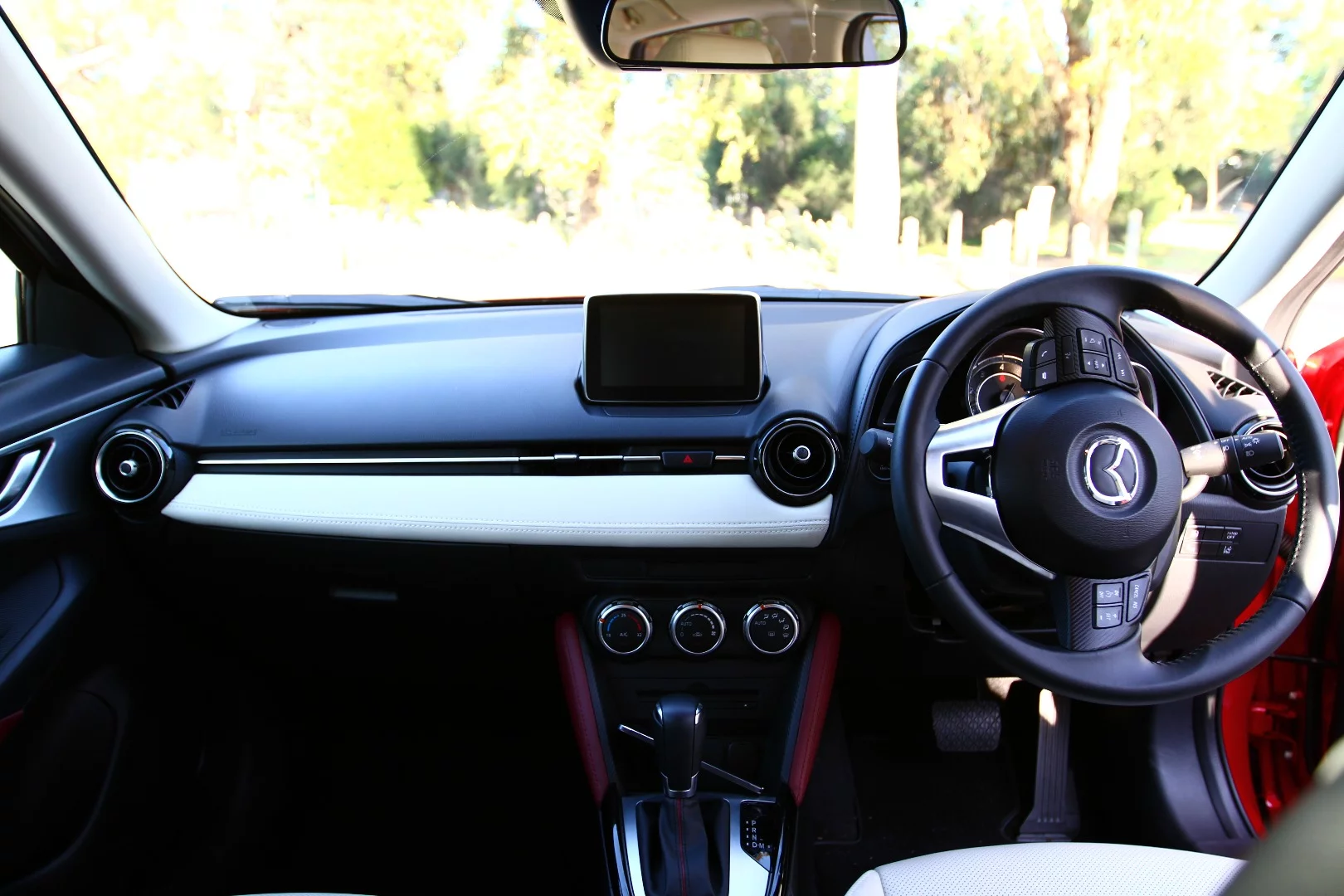 The CX-3's leather and suede trim is finished in three colours - a bit much for our tastes