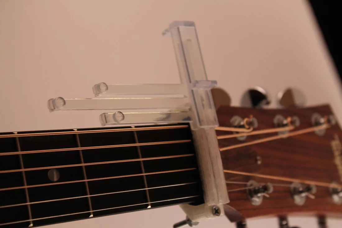 The system comes with three major chord shapes, with inserts that simply slide onto the system's top plate and into position